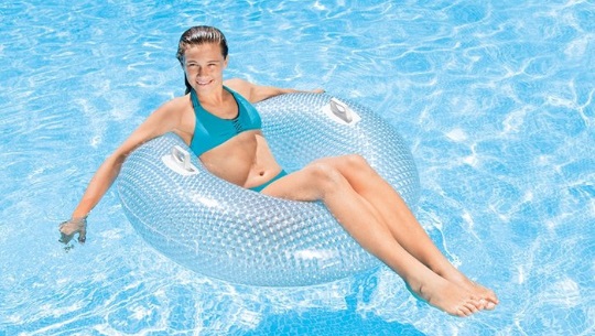 woman floating on pool tube