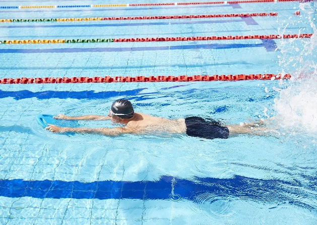a person swimming in pool