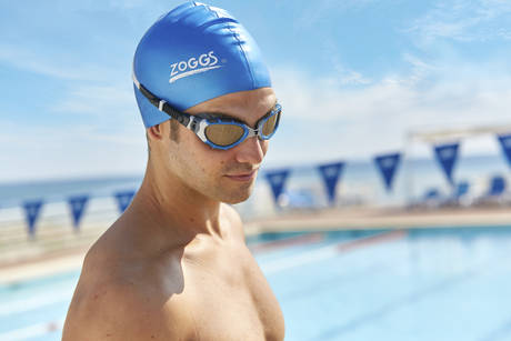 man wearing goggles in pool